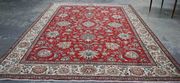 An Afghan prayer rug, mid-20th Century, the red mihrab with overall guls, within a flowerhead border, approx 118cm x 80cm.