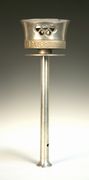 A London Olympics 1948 aluminium relay torch, the bowl pierced with the Olympic rings and cast with 'XIVth Olympiad 1948, Olympia to London, with thanks to the bearer', height approx 41cm (converted to a wall light having a drill hole to stem and bulb attachment to interior).