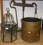 A brass lantern, a brass coal bucket and a set of scales.