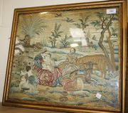 An 18th Century needlework panel with a design of the flight into Egypt with the Madonna and Christ Child with St Joseph amongst livestock, with two putti in the foreground, worked in coloured silks and chenille wools on a cream satin ground, approx 40cm x 47cm, within a gilt frame.