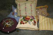A late 19th Century polychrome bead and gros point cushion with a design of fruit and flowers.