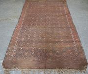 A large Afghan flatweave carpet, early 20th Century, the blue field with an overall lattice of guls, within a gul border, approx 330cm x 186cm.