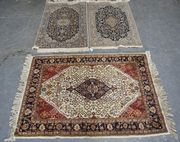 A Tabriz rug, North-west Persia, the blue field with a lobed medallion supported by foliate arabesques, within a palmette and scrolling vine border, approx 133cm x 84cm, together with a similar rug and an Indian rug.