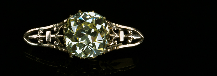 A large old mine cut cushion shaped fancy light yellow diamond