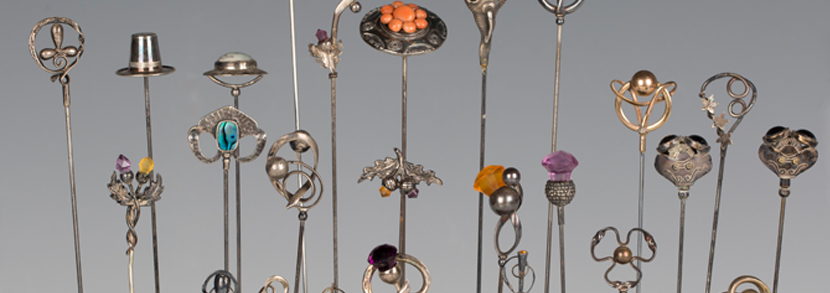 A collection of silver mounted hatpins including examples by Charles Horner