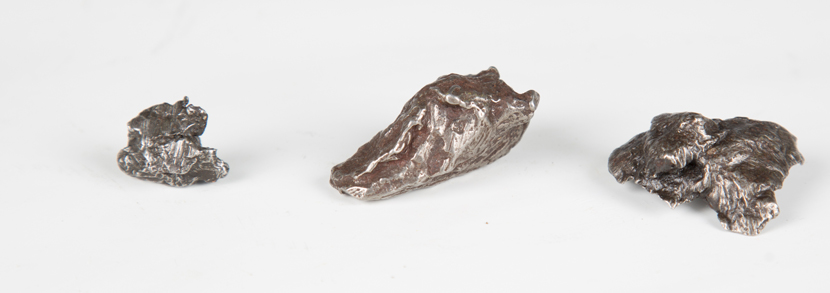 three Sikhote-Alin iron meteorite pieces