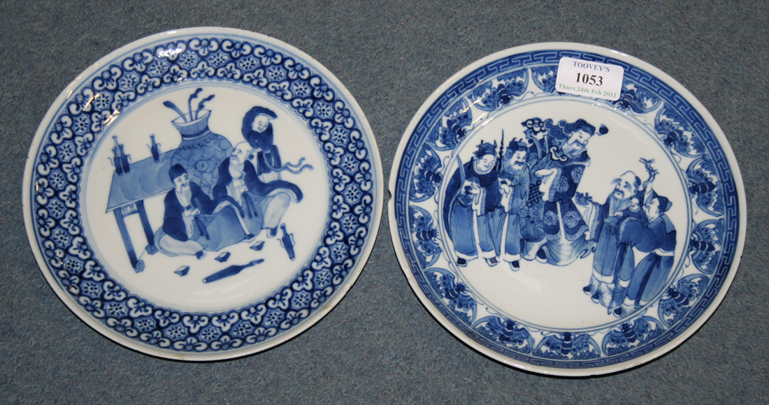 A Chinese blue and white plate, late 19th Century, painted with two ...
