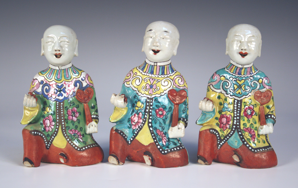 A group of three Chinese famille rose export porcelain jostick holder ...