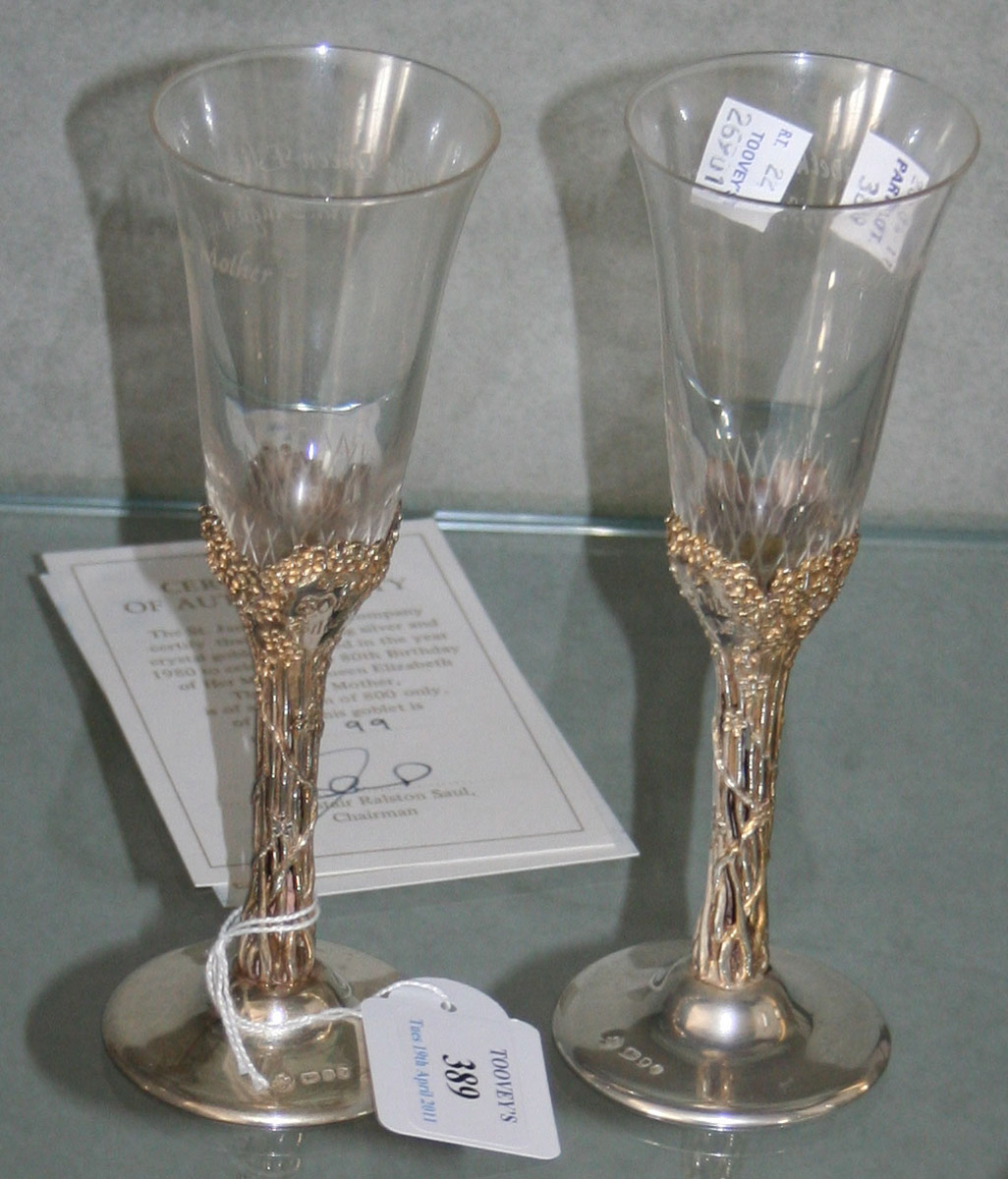 A pair of silver gilt and cut glass goblets commemorating the 80th ...