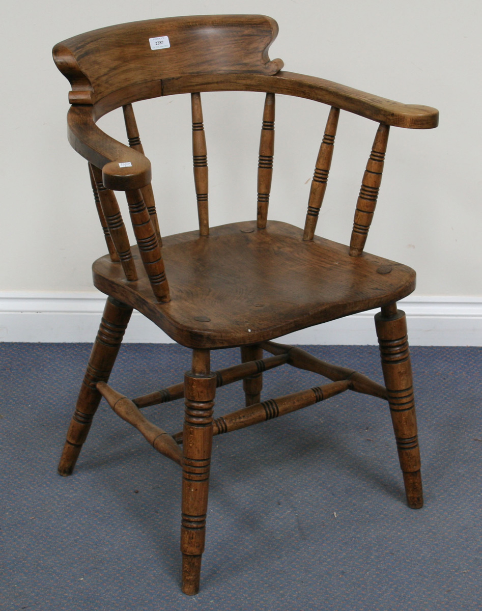 an-early-20th-century-beech-and-elm-tub-back-windsor-armchair-the