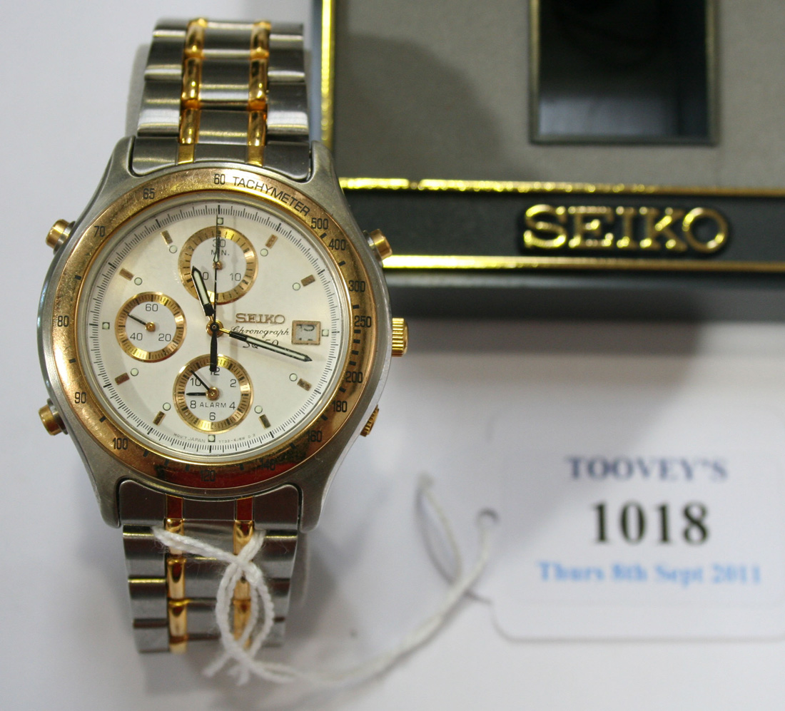 A Seiko Chronograph SQ 50 steel and gilt metal gentleman's bracelet  wristwatch, the signed dial