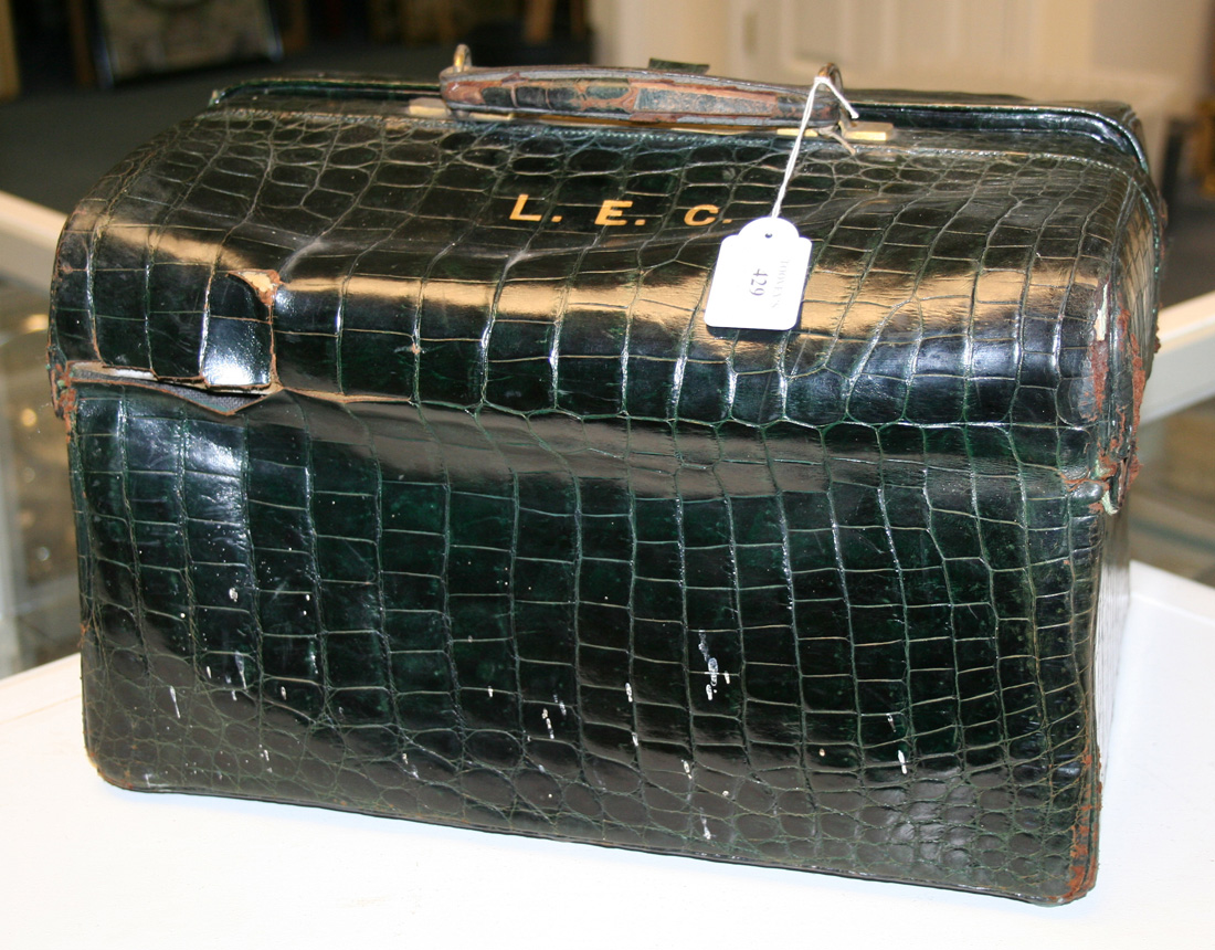 A late Victorian dark green crocodile skin Gladstone bag by Mappin  Brothers, partially fitted with f