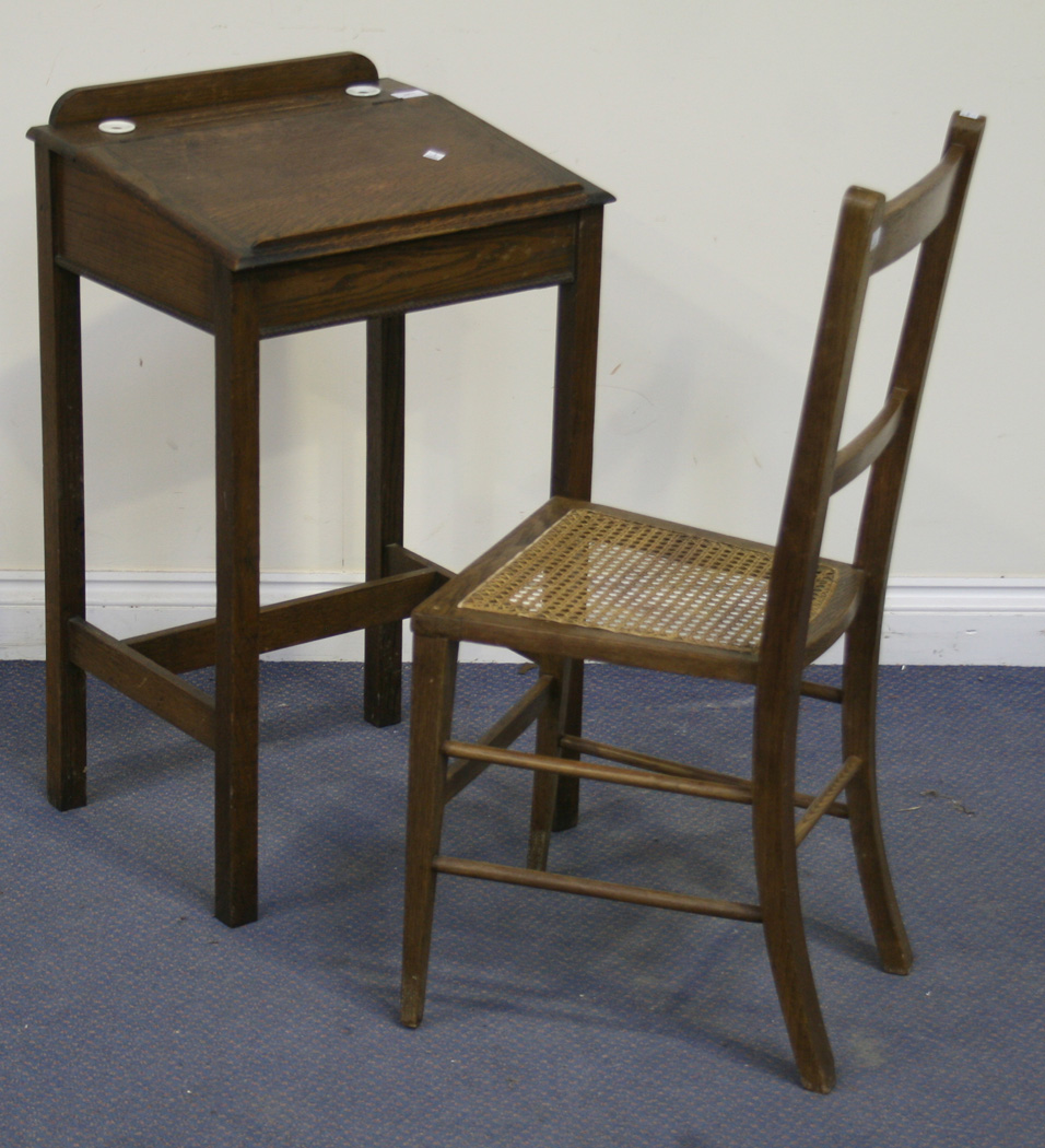 A George V Oak Child S Writing Desk With A Sloping Hinged Lid