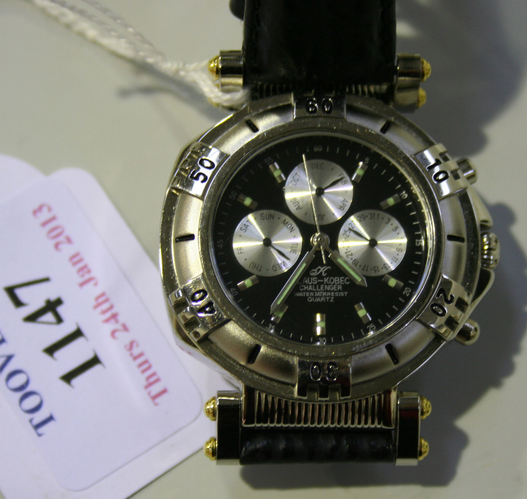 A Klaus Kobec Challenger steel gentleman s wristwatch on a black strap with the original book