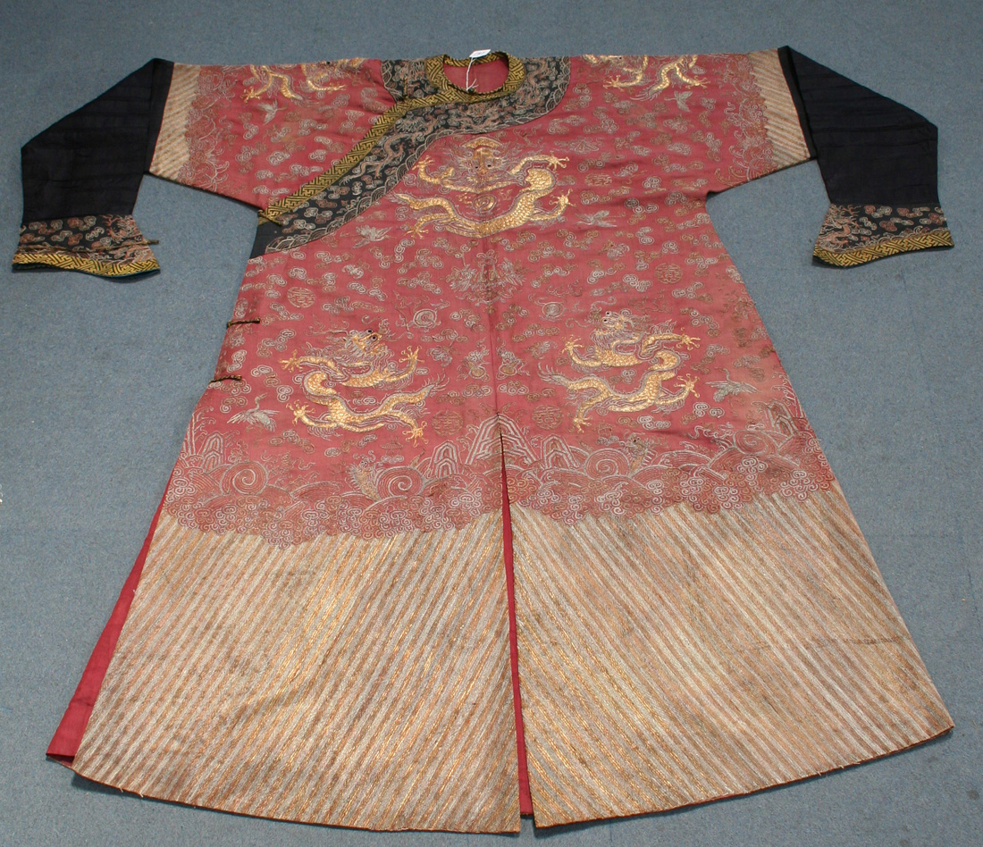 A Chinese red silk embroidered formal court robe (chi fu), late 19th ...