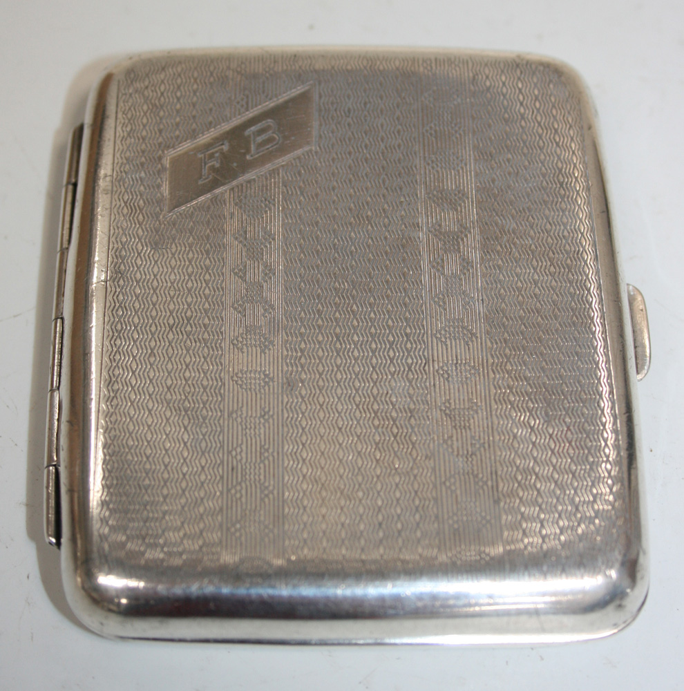 A George V silver cigarette case, with engine turned decoration and ...