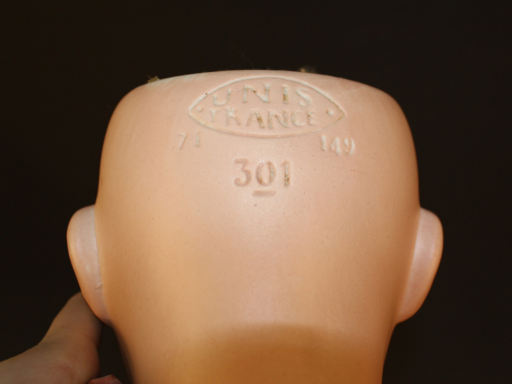 An Unis France bisque head doll, impressed '71 301 140 301 14