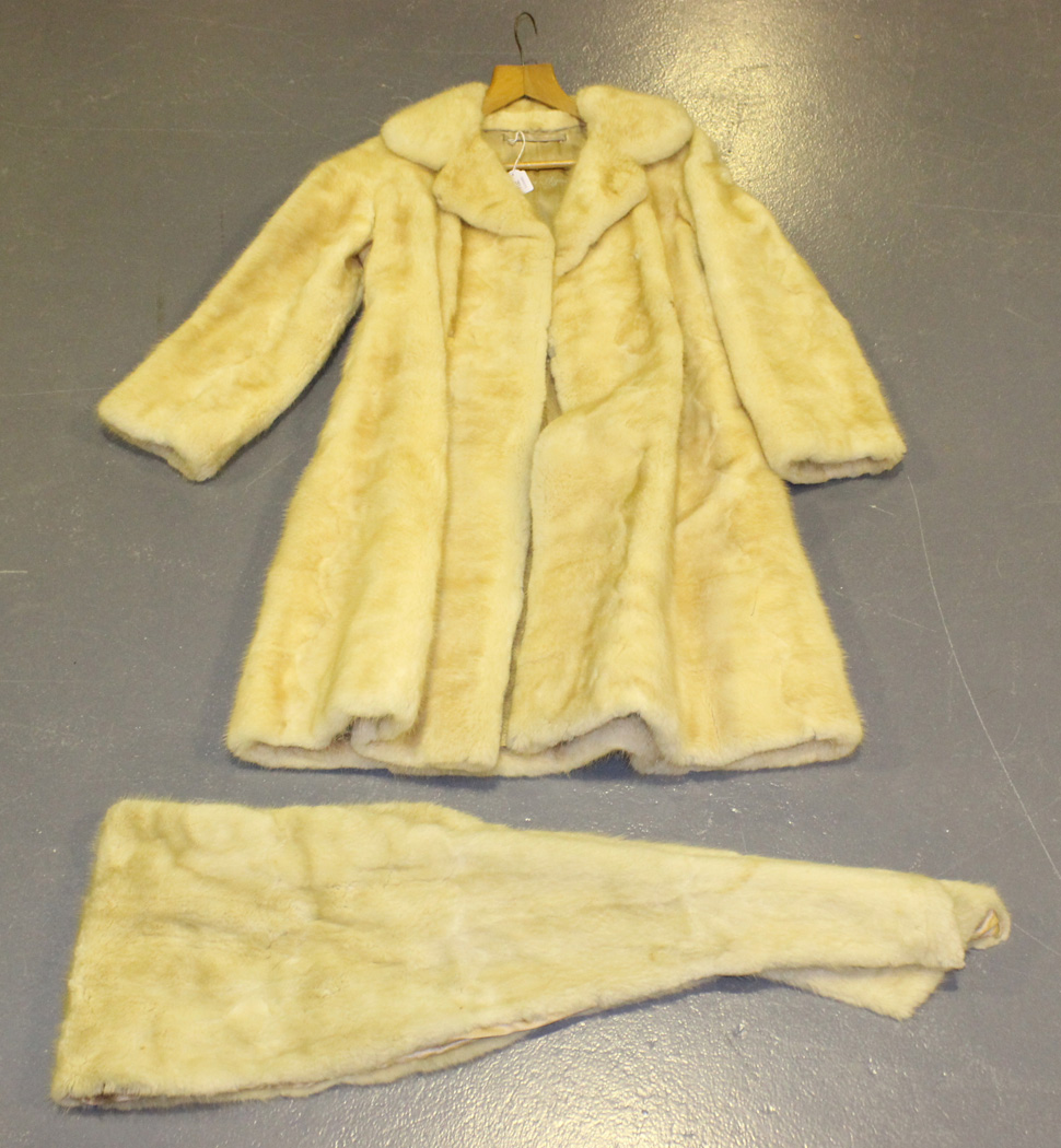 A mid-20th Century cream fur three-quarter length coat, the silk lining ...