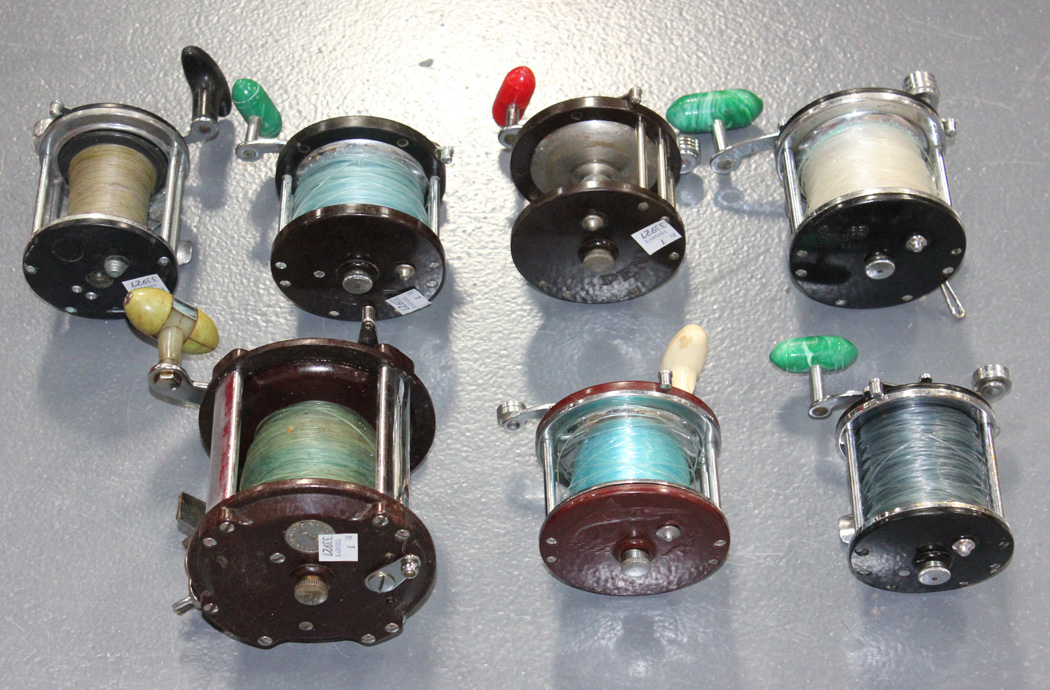 A group of seven fishing reels, including a Grice & Young Tatler, a Penn  No. 160, a Penn 65, a P