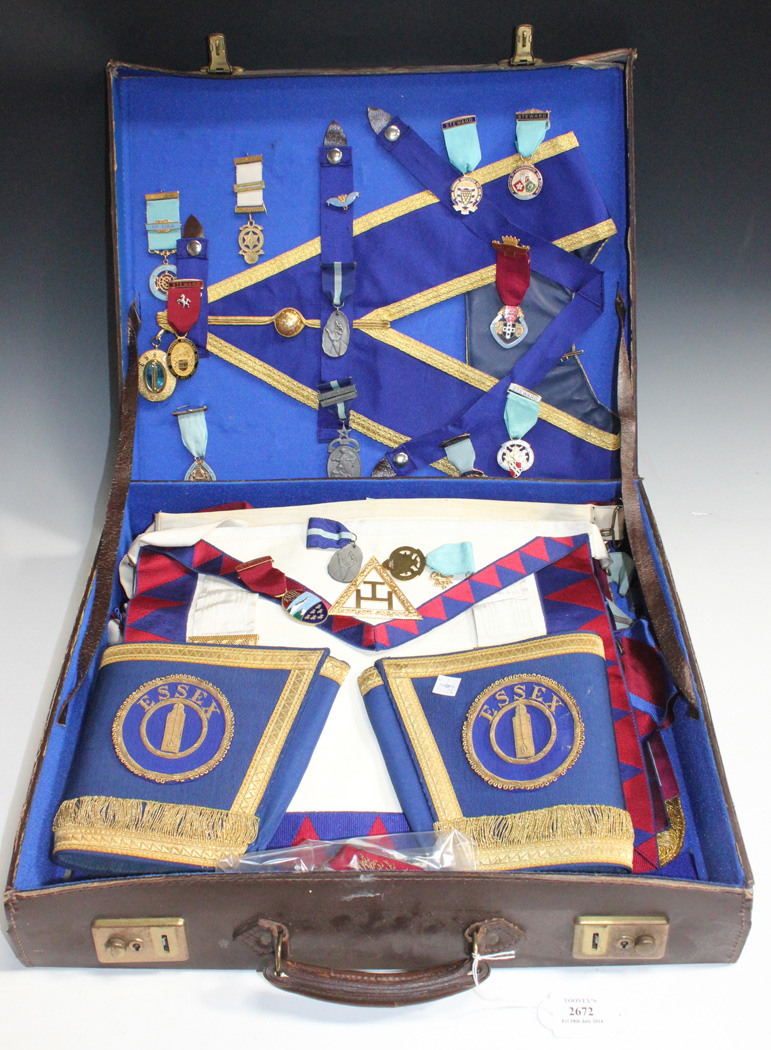 A collection of Masonic regalia, including a group of silver medals and ...