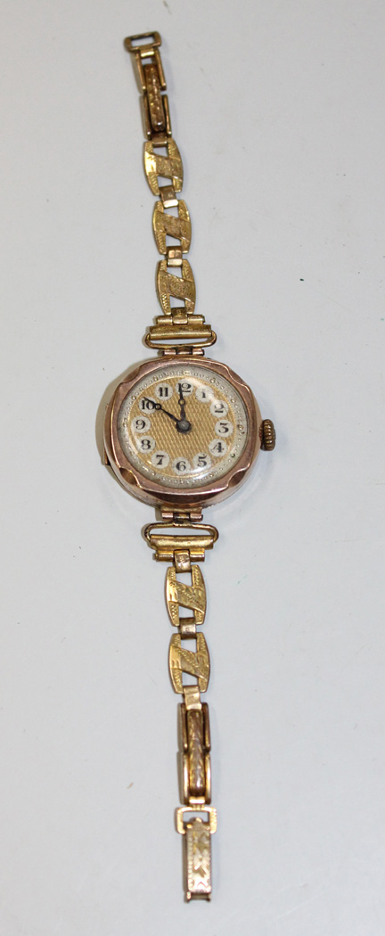 A 9ct gold circular cased lady's wristwatch with a jewelled Swiss ...