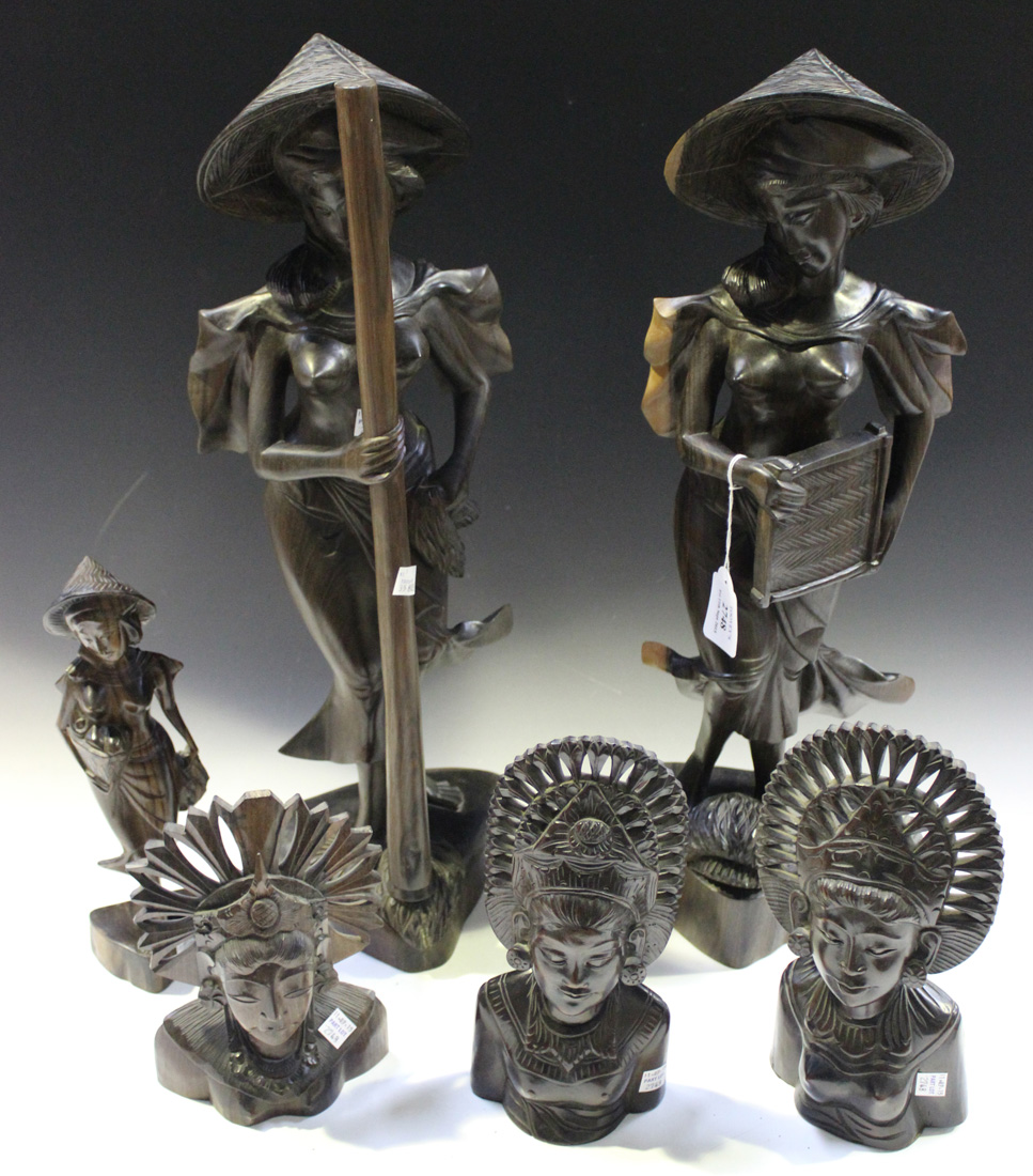 A group of mid/late 20th Century Balinese carved hardwood figures, including a pair of figures of se