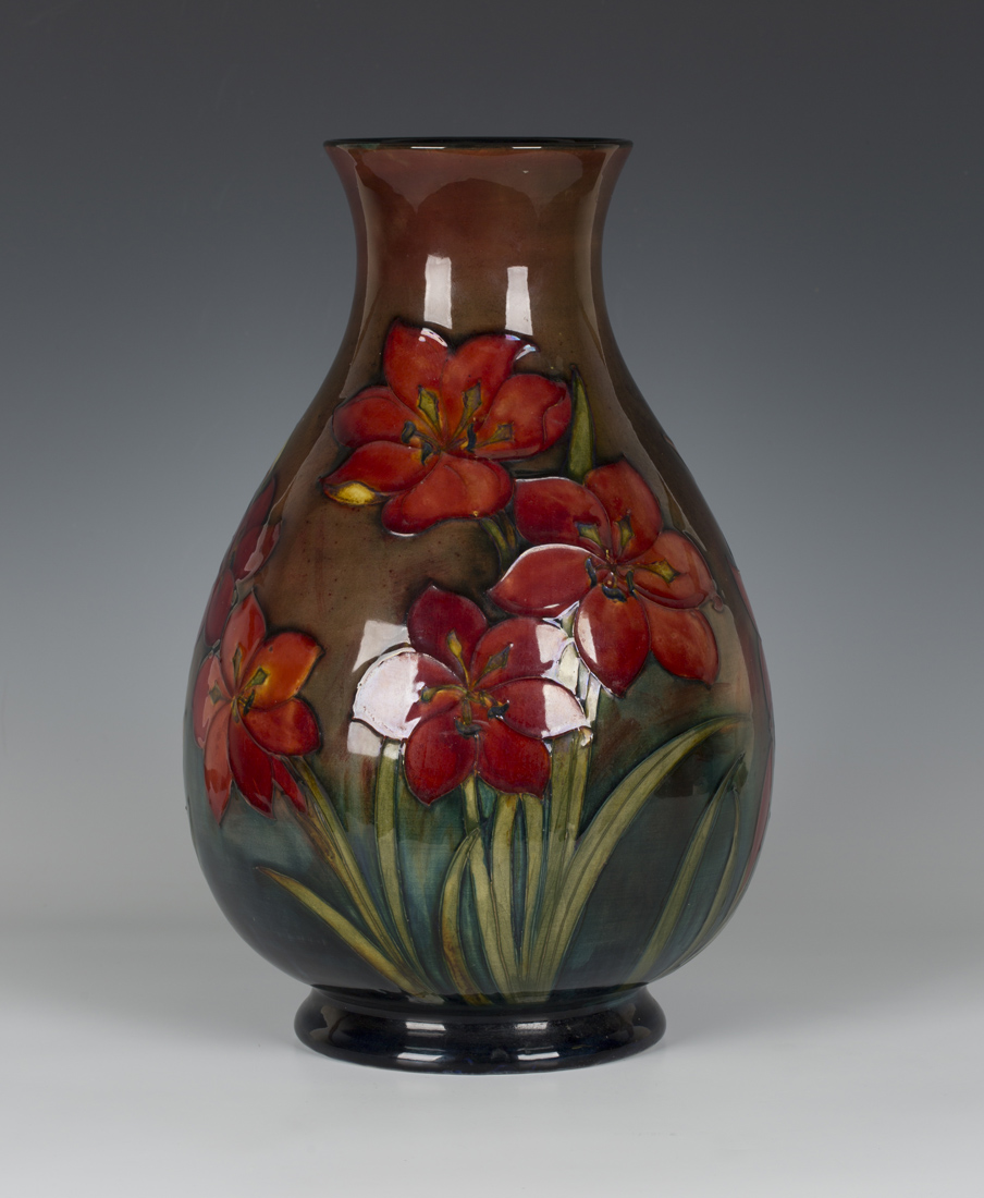 A Moorcroft pottery flambé vase, circa 1950s, the ovoid body and narrow ...
