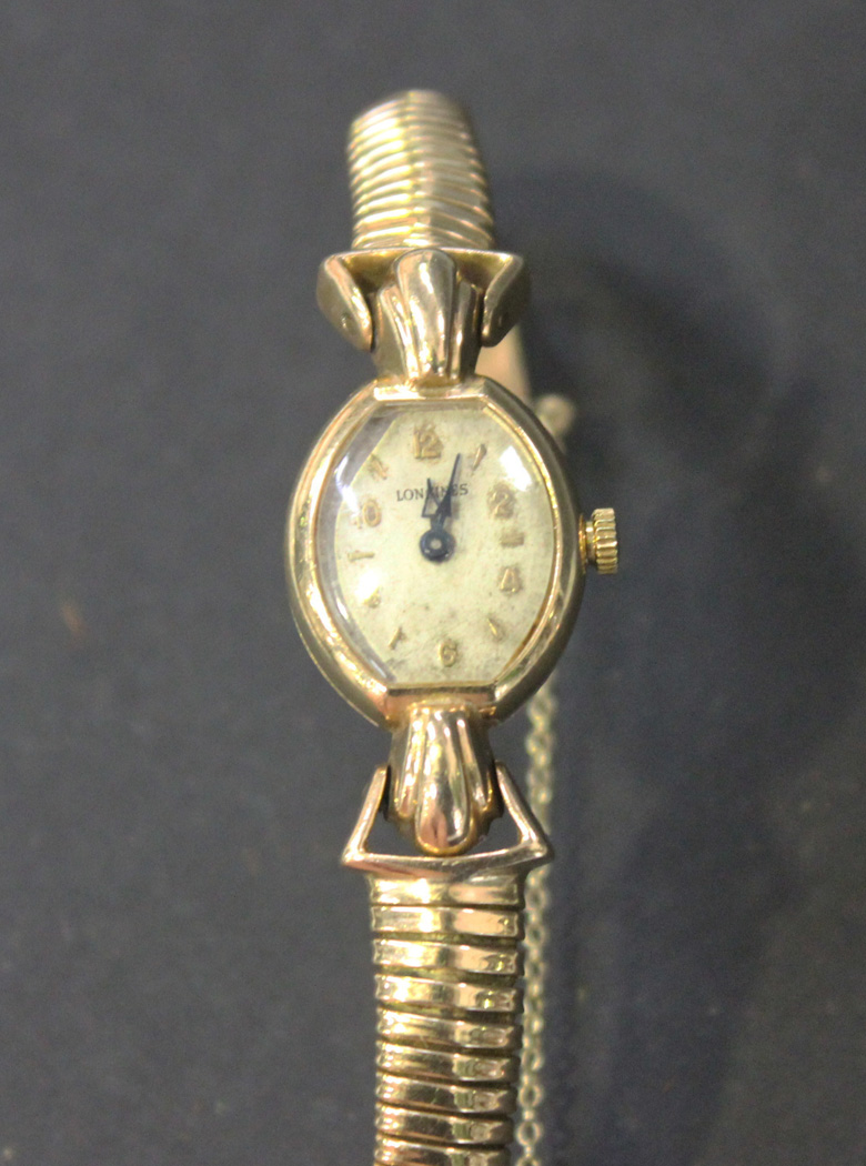 A 9ct gold oval cased lady's wristwatch with a replacement electronic ...
