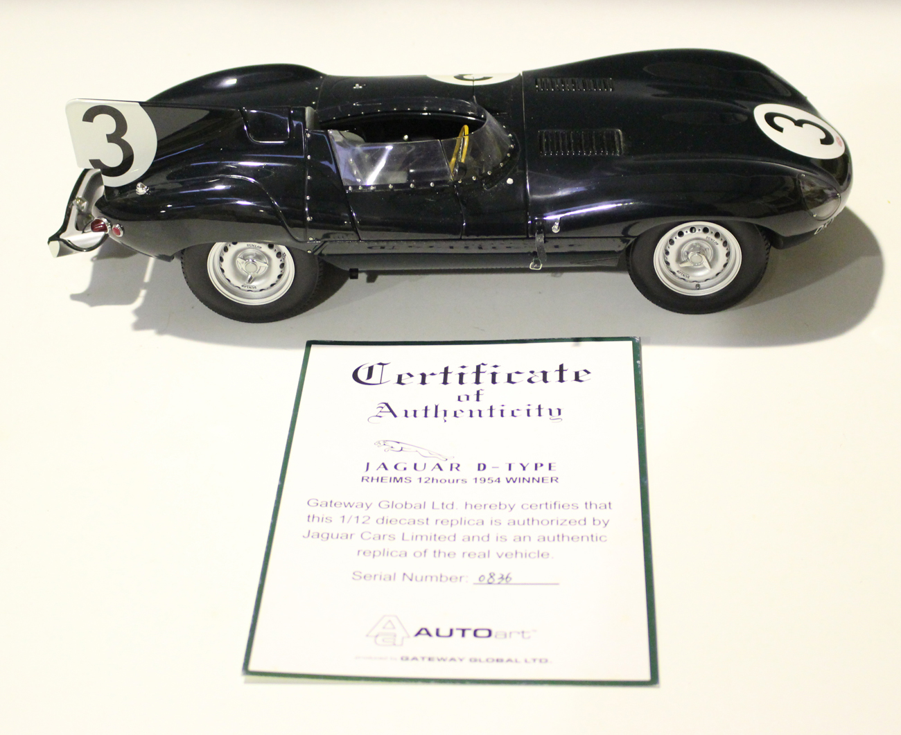 An AutoArt 1-12th scale model of the Jaguar D-Type 1954 Rheims 12