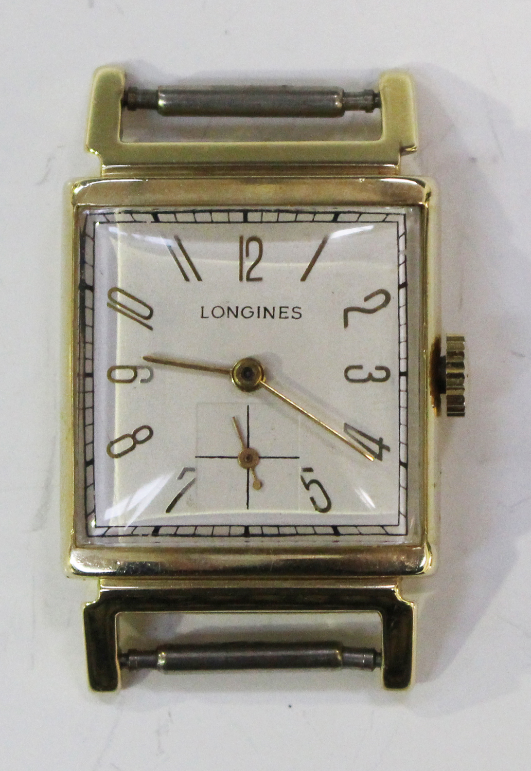 A Longines gold square cased gentleman's wristwatch, the signed ...