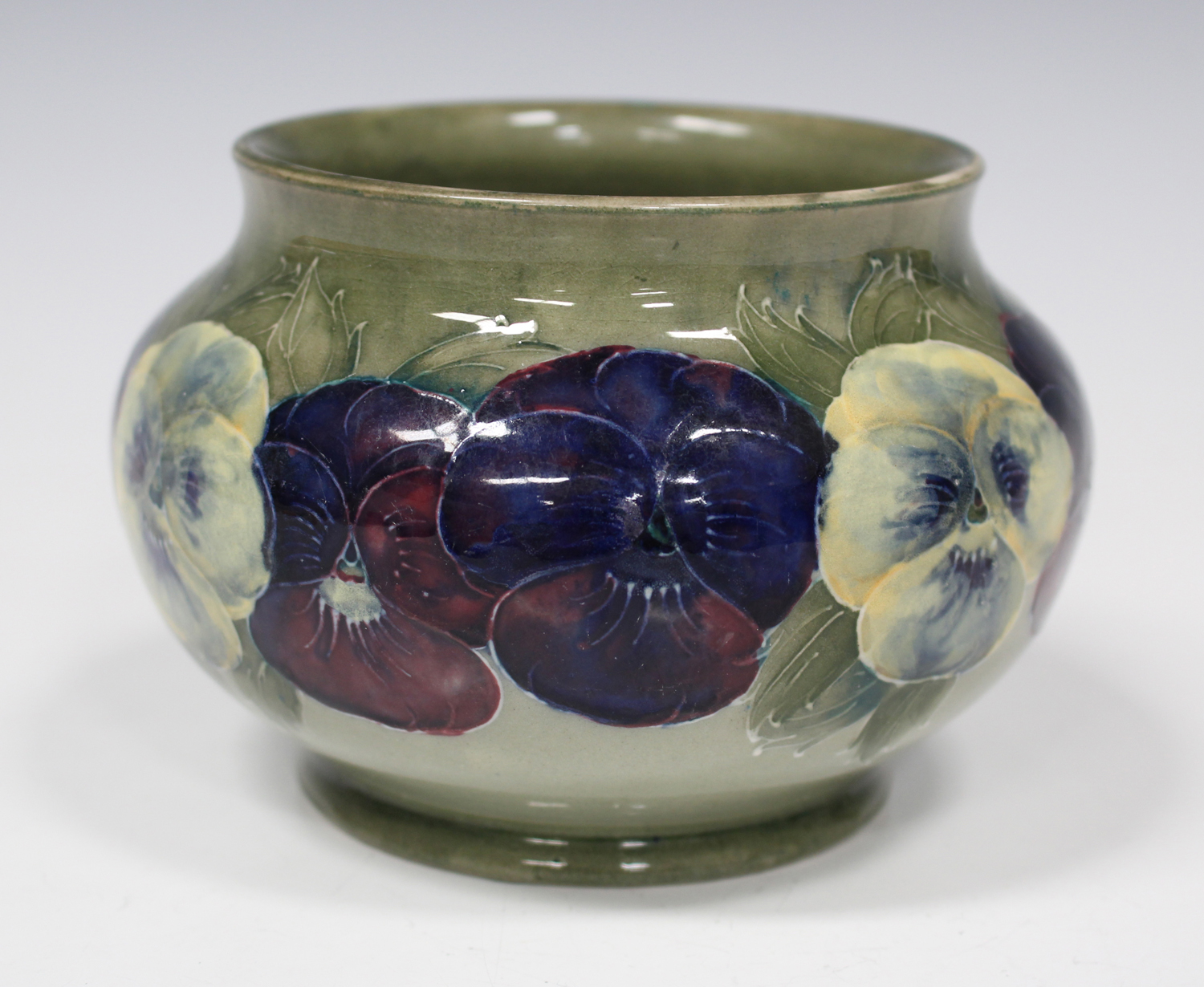 A Moorcroft pottery vase, circa 1916, the bulbous body decorated with ...