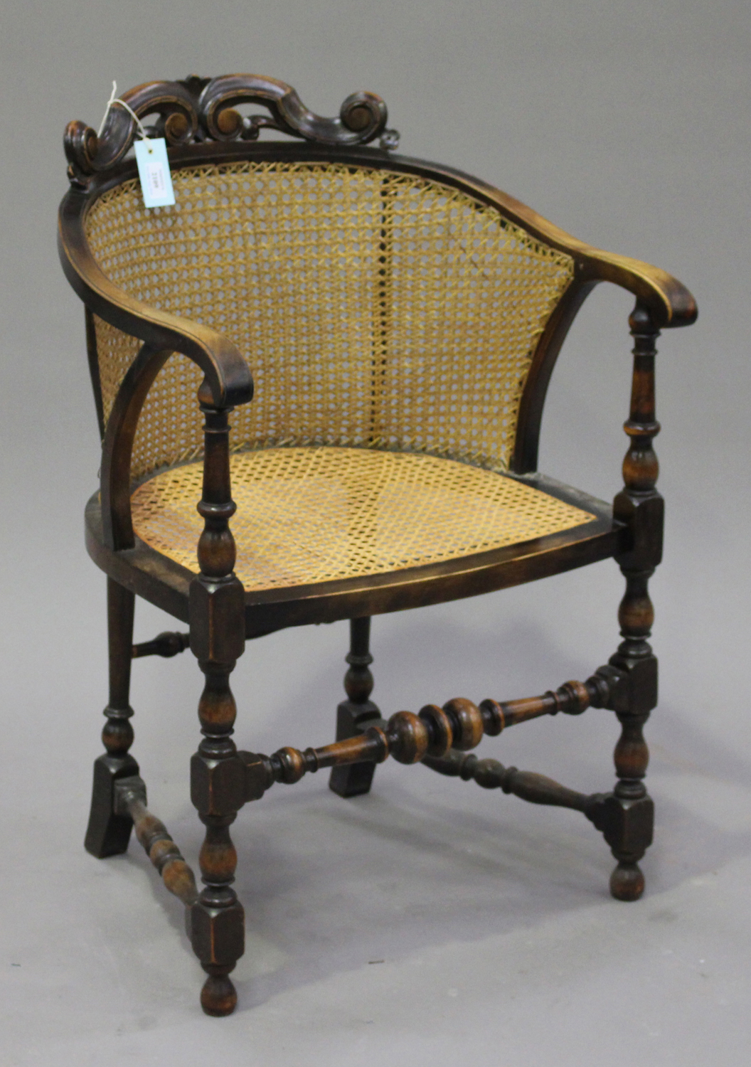 A George V Walnut Framed Tub Chair The Cane Back With Carved