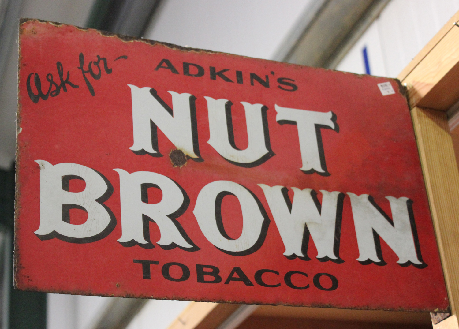 A double-sided 'Adkin's Nut Brown Tobacco' enamelled advertising wall sign,  30.5cm x