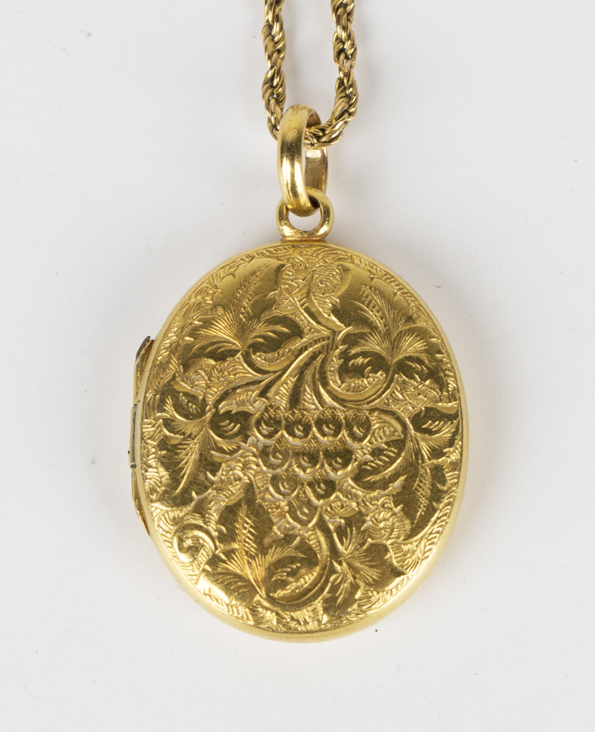 A Victorian gold oval pendant locket, the interior glazed with ...