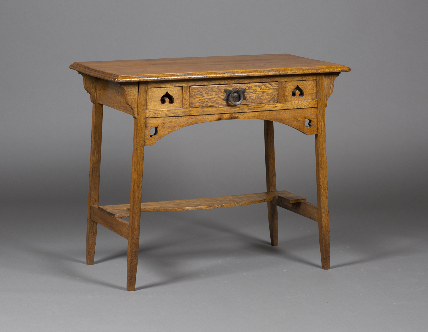 An early 20th century Arts and Crafts oak side table in the