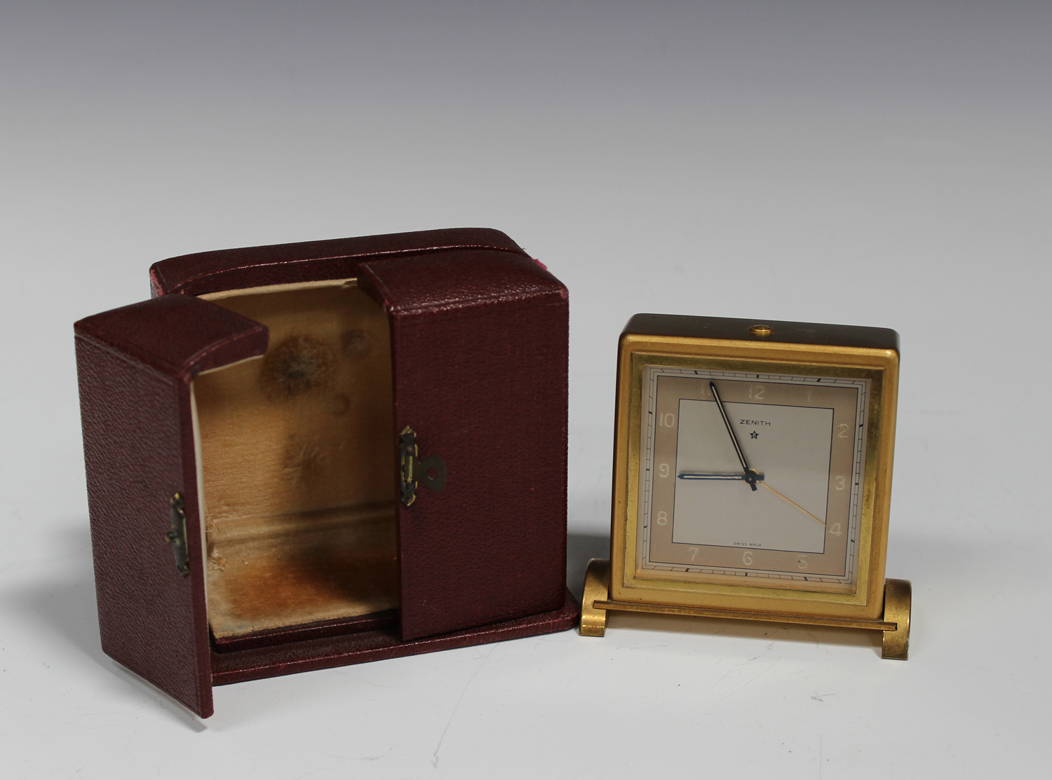 A Zenith gilt brass cased bedside alarm clock with eight day movement ...