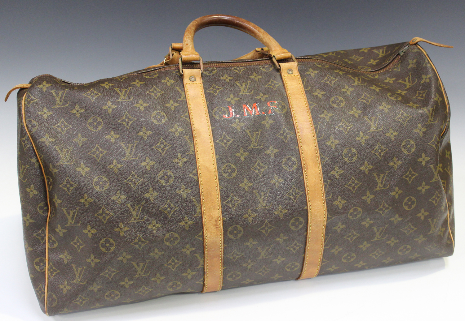 A Louis Vuitton Keepall 55, the monogram canvas body with tan leather trimming and handles, length 5
