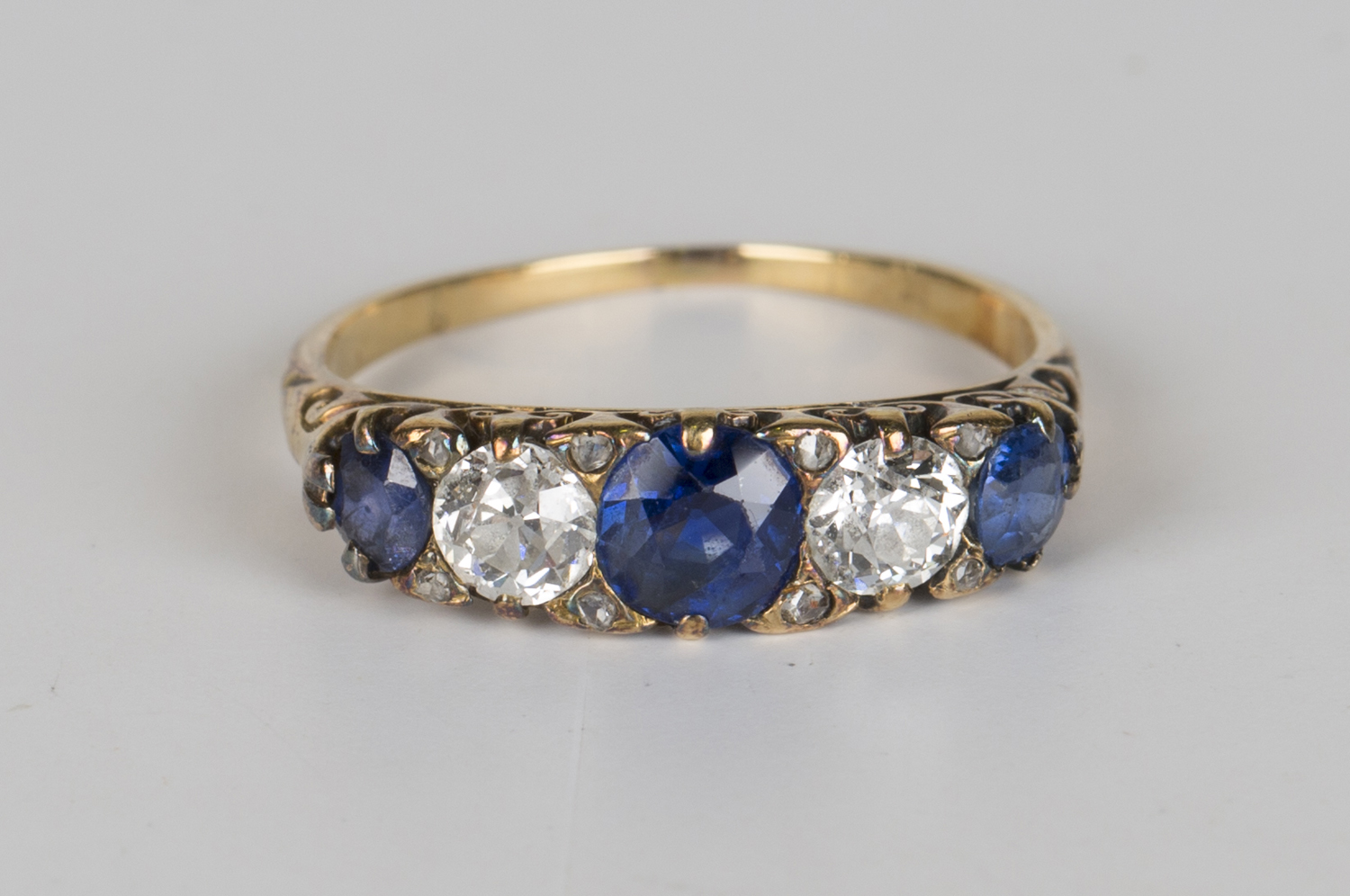 A gold, sapphire and diamond five stone ring, mounted with three ...