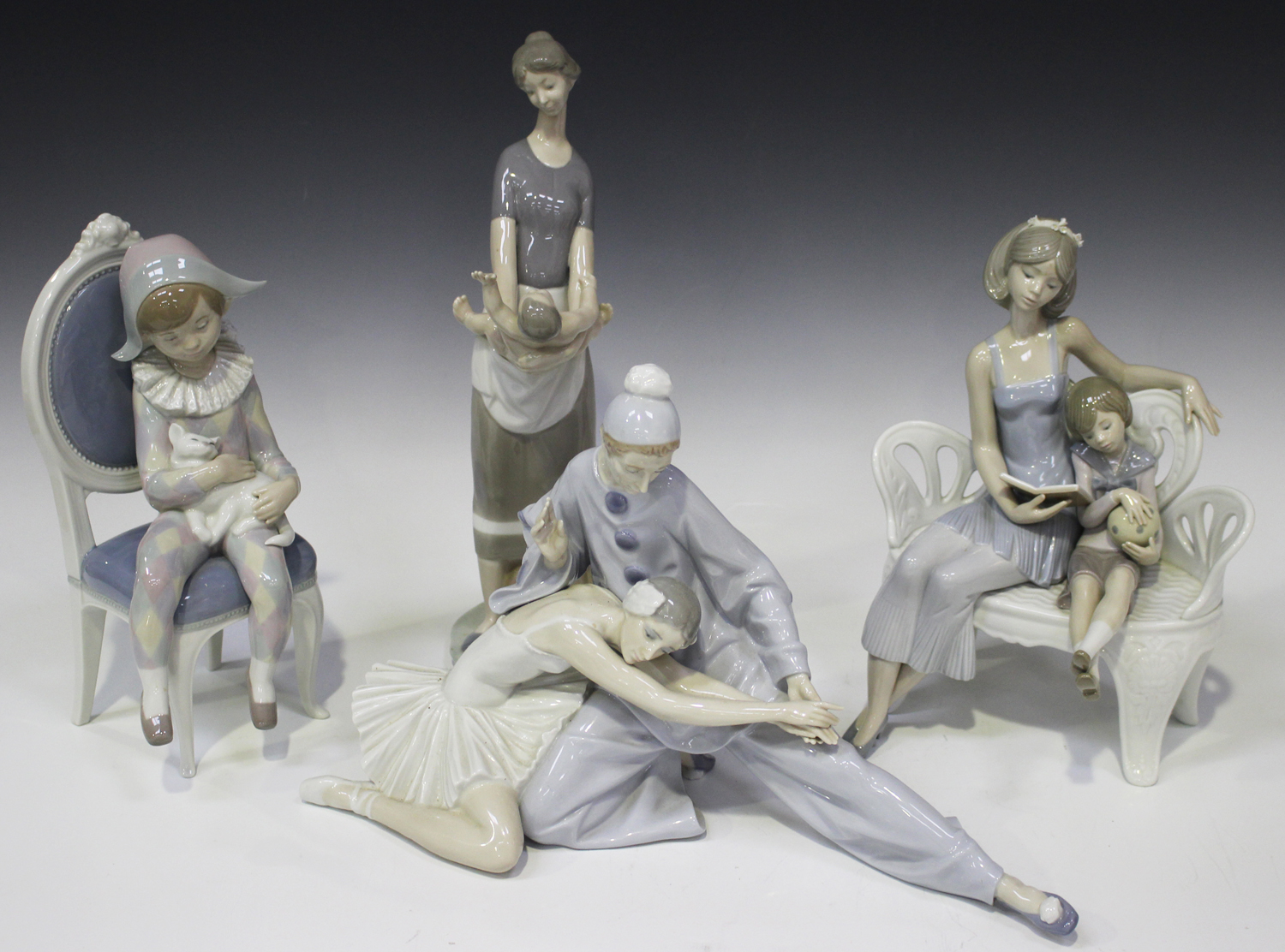 Four Lladro porcelain figure groups, comprising Closing Scene, No. 4935,  Once Upon A Time, No. 5721