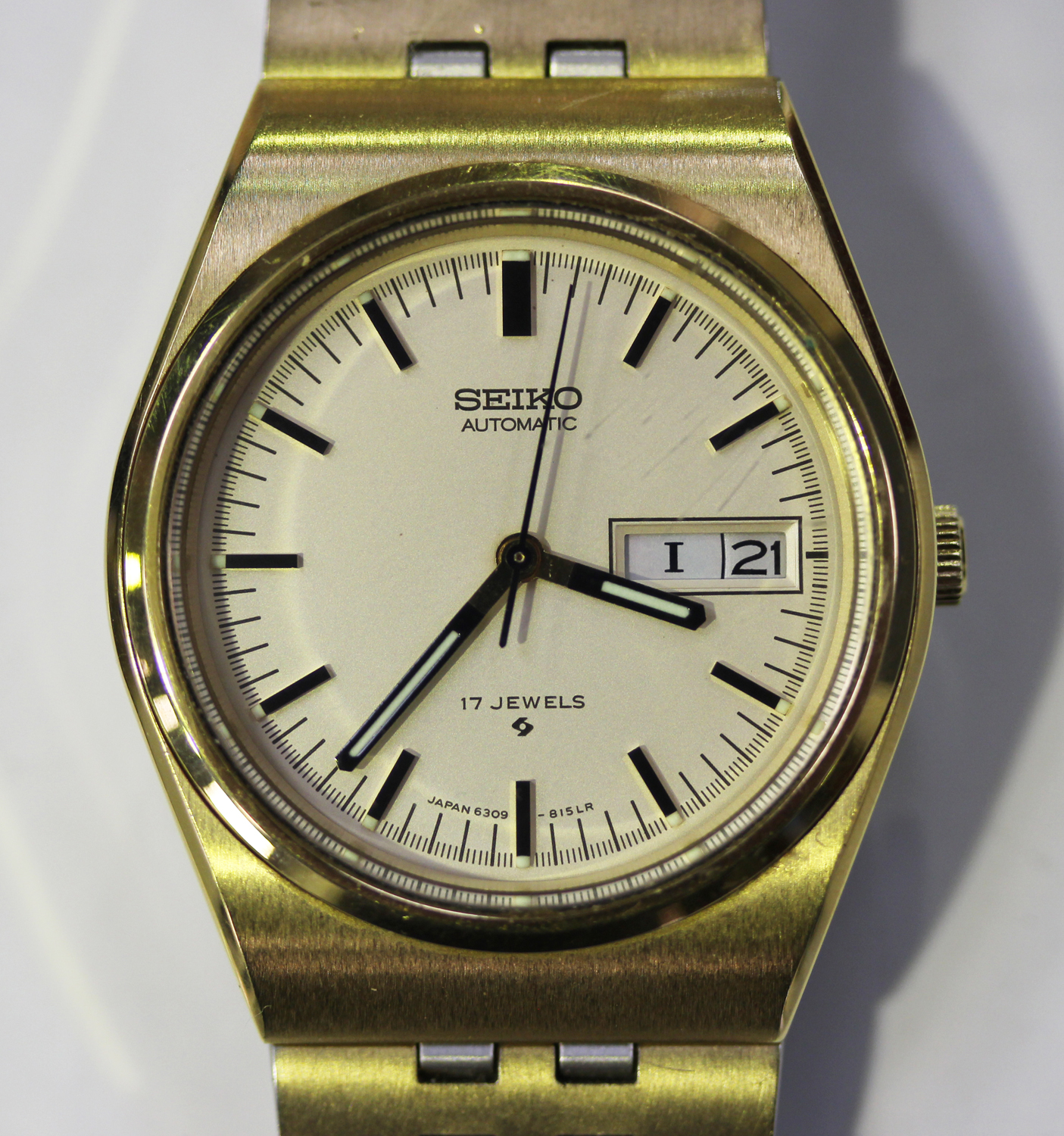 A Seiko Automatic gilt metal and steel gentleman's bracelet wristwatch, the  signed dial with ba