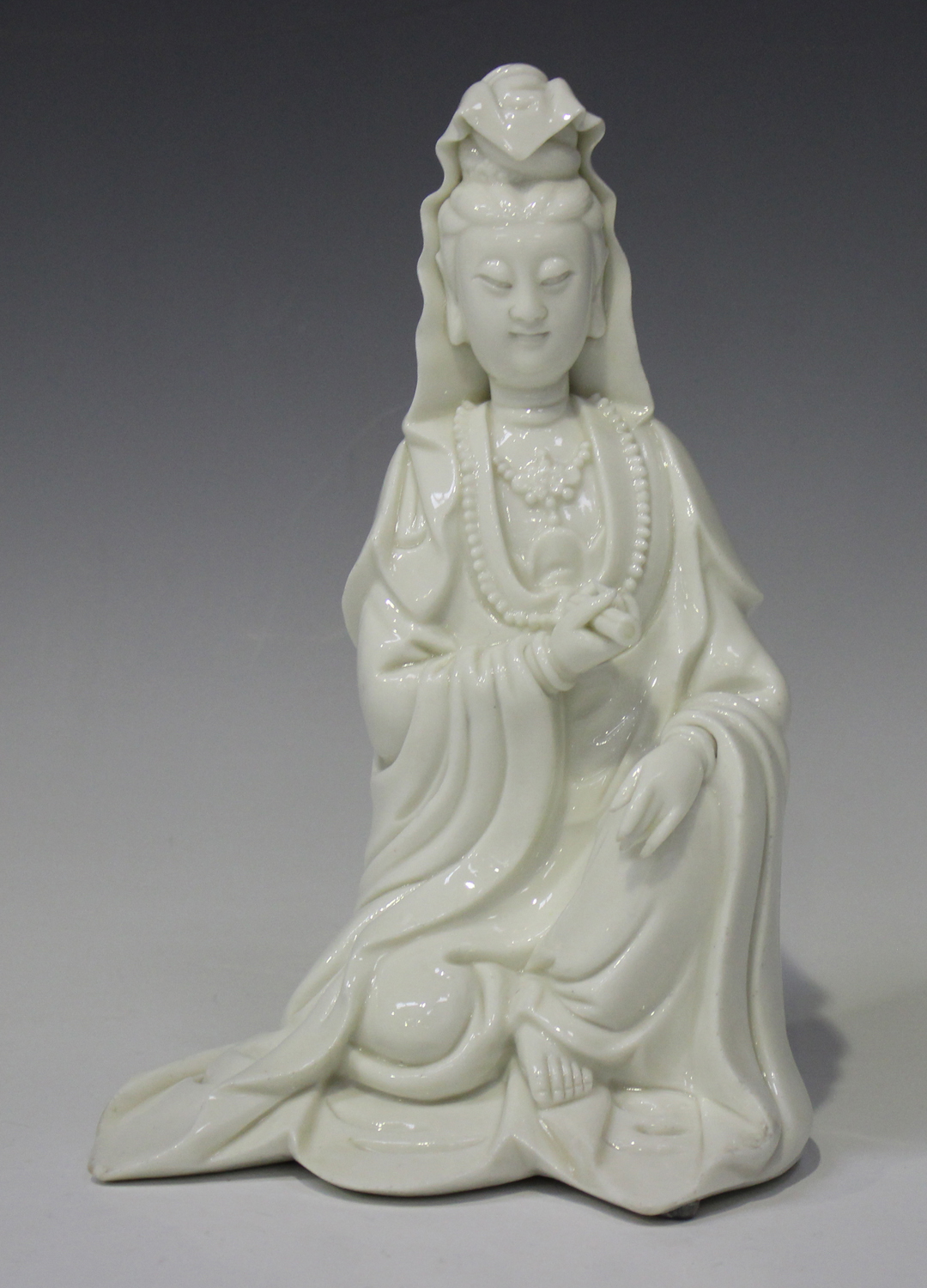 A Chinese blanc-de-Chine porcelain figure of Guanyin, Qing dynasty