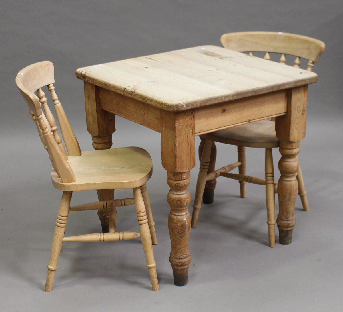 A 20th century pine twoseater kitchen table, height 77.5cm, width 76cm, depth 75cm, together with a