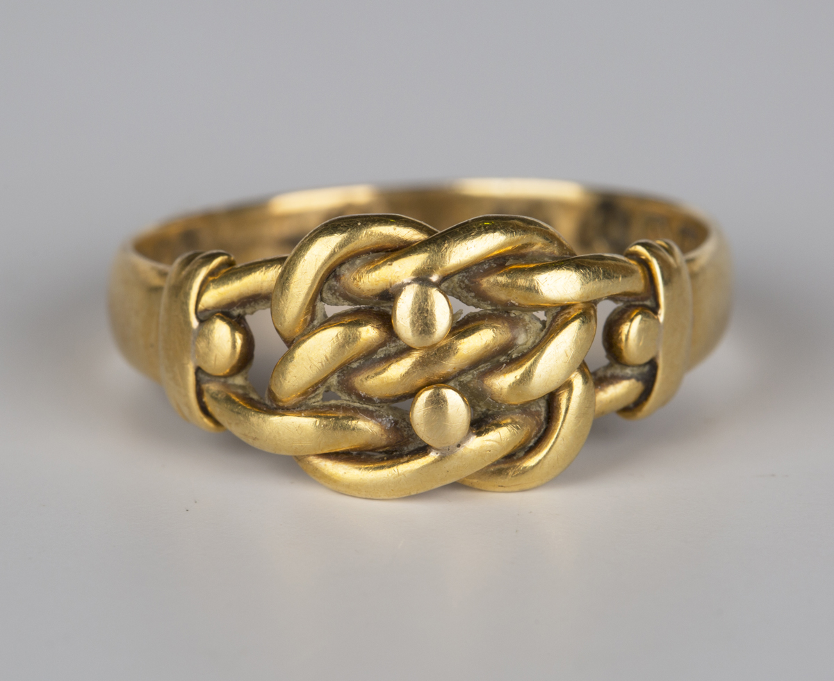 An Edwardian 18ct gold ring in a beaded and interwoven design ...
