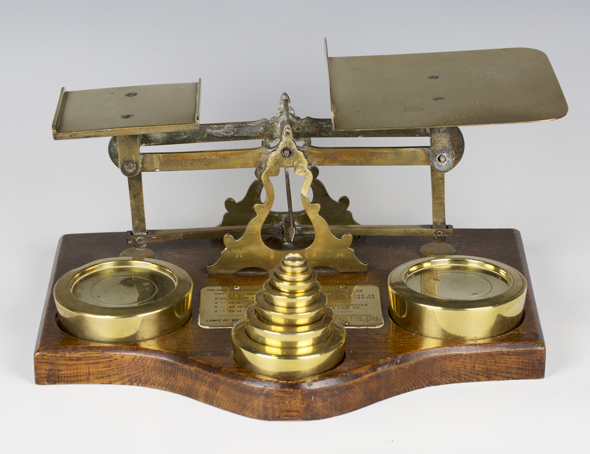 A set of large late 19th century brass postal scales and weights