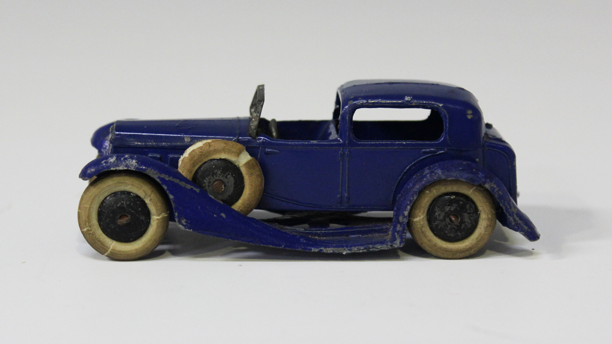 A pre-war Dinky Toys No. 24c town sedan car, finished in blue with black wheels and white tyres (som