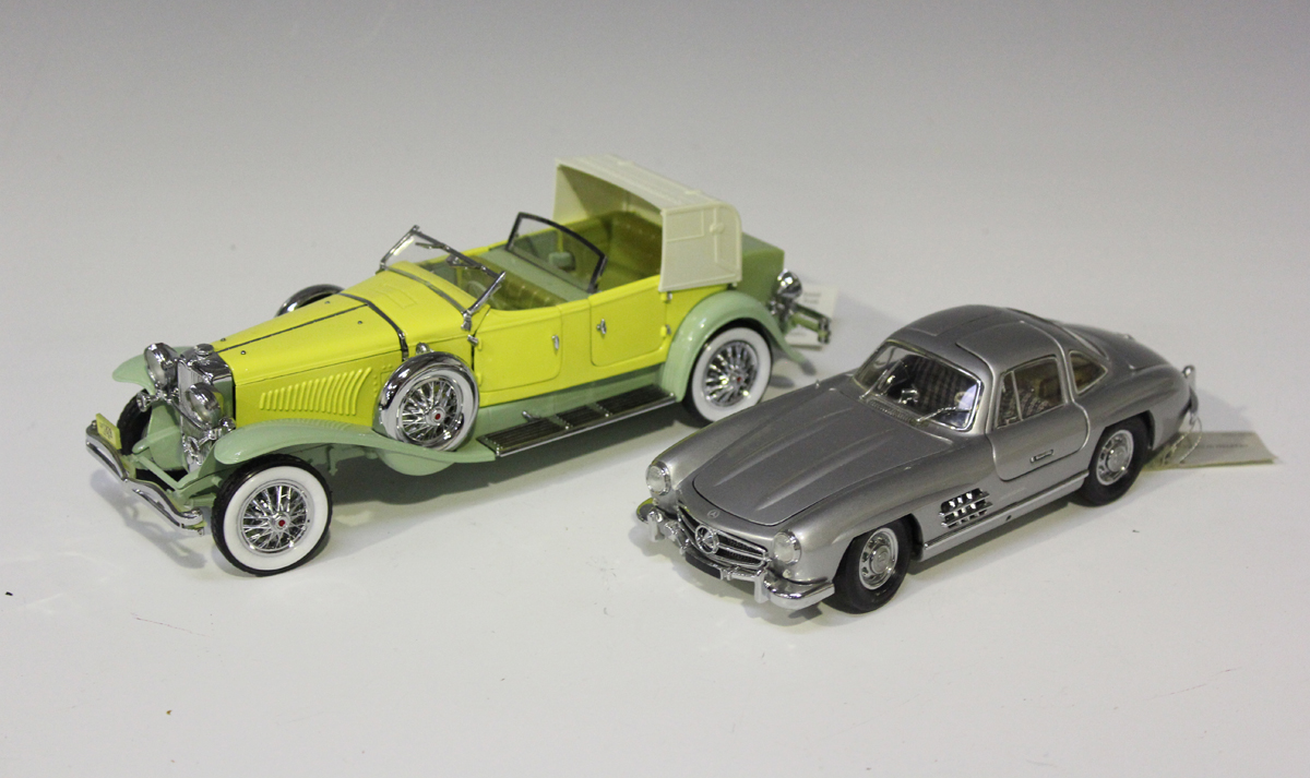 Eight Franklin Mint 1:24 scale model cars, comprising a 1930