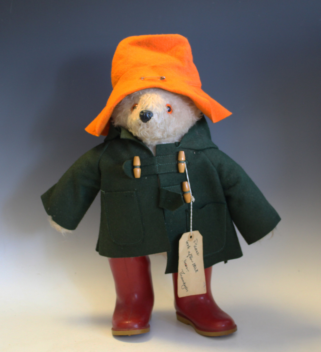 A Gabrielle Designs Paddington Bear, wearing an orange hat, green ...