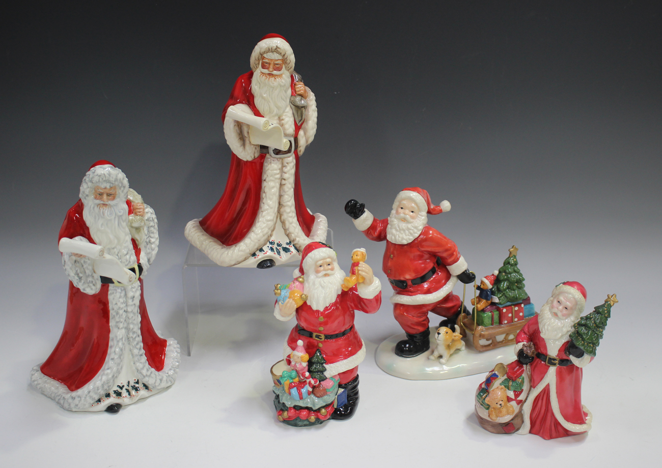 Two Royal Doulton figures of Father Christmas, HN5040, gilt painted ...