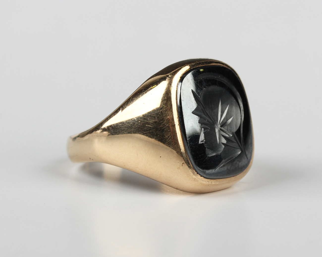 A 9ct gold and hematite intaglio ring, designed as a classical portrait ...