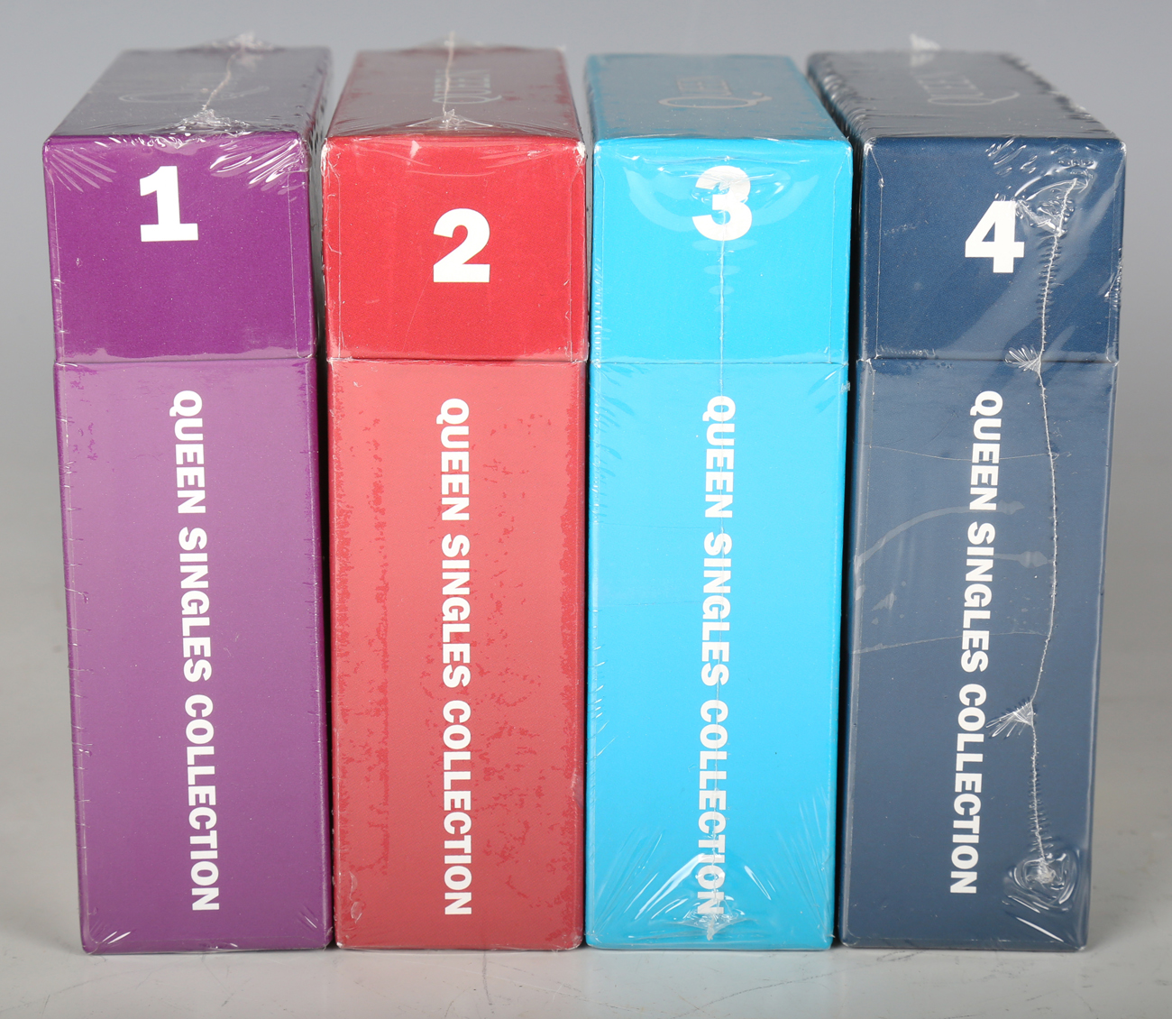 A series of four CD box sets, 'Queen Singles Collection', Volumes